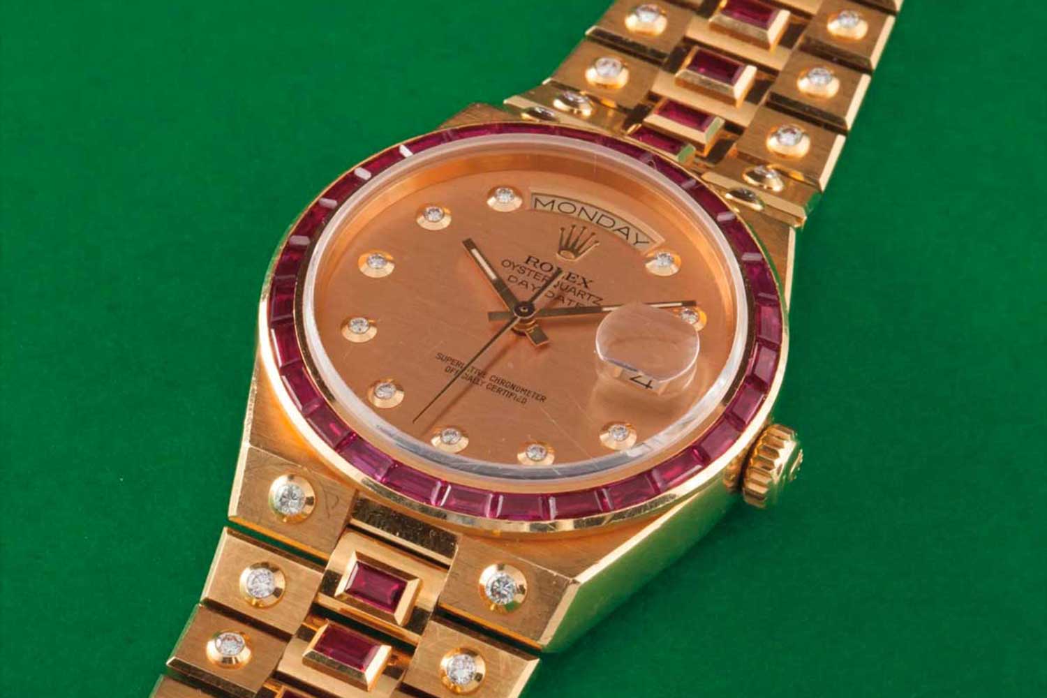Rolex Day-Date Oysterquartz ref. 19168 in 18k yellow gold, decorated with diamonds and rubies; sold on 9 May 2015 for CHF110,000 (Image: Phillips)