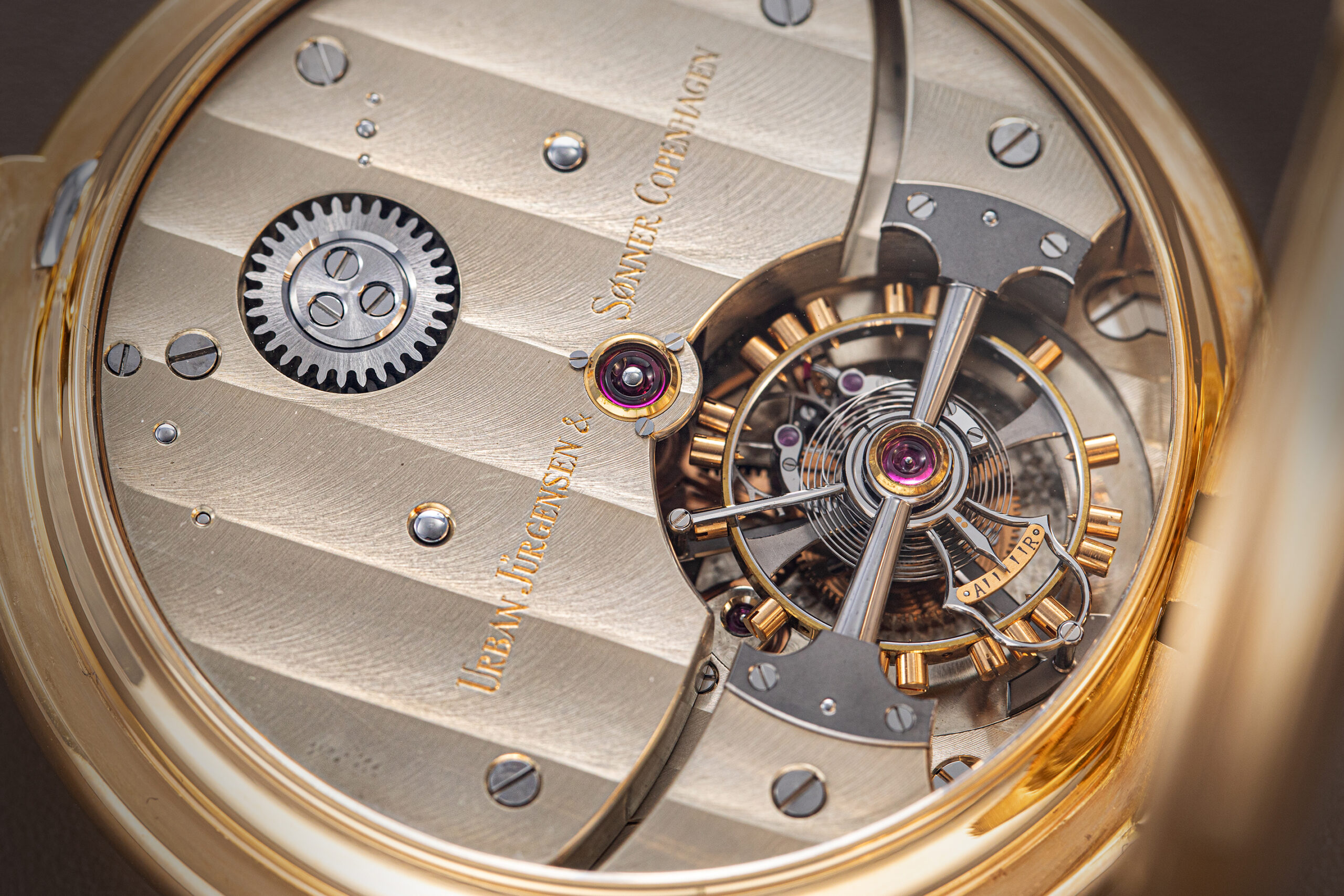 The finely finished tourbillon movement features twin barrels and a bimetallic compensation balance wheel (Revolution©)