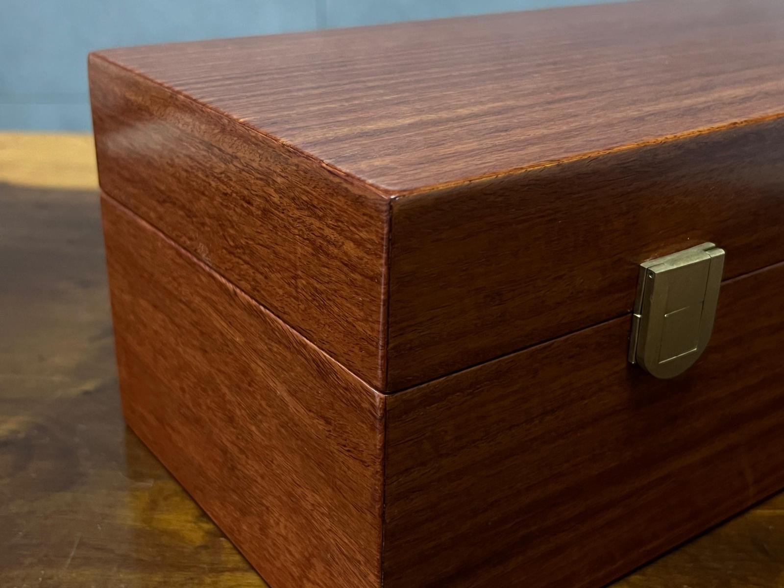 The box set is meticulously hand-polished to achieve a smooth, lustrous finish